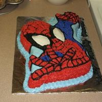 Spiderman Cake Chocolate cake with buttercream icing. I used the Wilton Spiderman pan.
