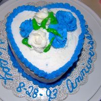 Wedding_Cake_003.jpg I did this real fast and in a hurry for a friend last minute. I was making the roses for my course 3 wedding cake and it was a must to get...