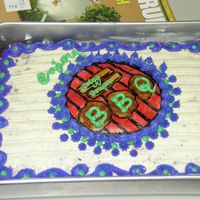 Ggs Bbq Cake First cake with rice paper. Devils Food. Cream cheese and buttercream frostings. Made my own design for the bbq top and did the gel thing....