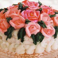 A Basket Of Pink Roses White basket of Pink Roses for Mother. White basketweave cake topped with pink royal icing roses with green leaves