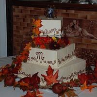 Whitney & Michael's Fall Wedding Cake Bottom tier was a fake tier to present a large centerpiece for a small wedding. The couple wanted a fall theme. I really am not very good...