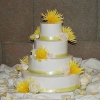 Casey & Arryn's Wedding Cake This is a creme brulee cake with bavarian cream filling and buttercream frosting (thanks Sugarshack for the great techniques!) The flowers...