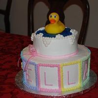 Ella's Baby Shower Cake This was a fun cake! Used the wilton cake divider to make 10 blocks around the lower level. ELLA was in the "front" four blocks...