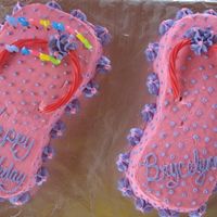 Flip Flops Carved from two 1/4 sheet cakes. Used pink starbursts twists as the straps.