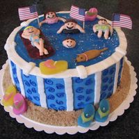 Swimming In The Pool Checkerboard cake with buttercream icing. Kids are royal icing.