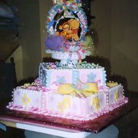 Poohbaby~0.jpg 2 tier buttercream with fondant accents.