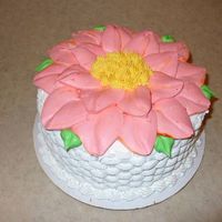 P1000189.jpg double layer 8" with whipped icing, basketweave around the side, and giant flower on the top