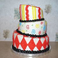 P1000405.jpg My first attempt at a topsy turvy cake. 10",8", & 6" with whipped icing.