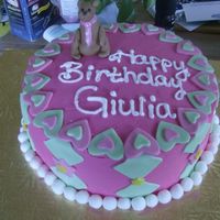 Pink And Green Bear Cake Birthday girl liked the colors pink and green. I thought the bear would be cute to add to the cake, it was my first time making a fondant...