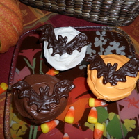 Chocolate Bat Cupcakes Vanilla and chocolate cupcakes frosted with milk chocolate and vanilla (food colored orange). Homemade bats are semi-sweet chocolate...