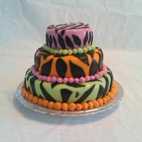 Animal Print This was my daughters 9th birthday cake. I can not take all the credit for this one. I covered the bases of these cake and my husband and...