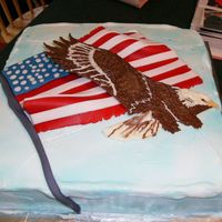 Bird Of Freedom I made this for my brothers 4th party. The Eagle is a chocolate transfer and the flag is mmf.