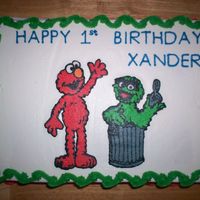 Elmo And Oscar Birthday Cake 9" X 13" Yellow sheet cake with chocolate buttercream between layers, frosted with buttercream. Elmo and Oscar (my nephew's...