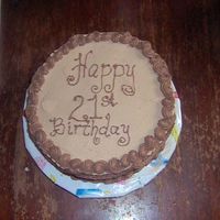Jim's 21St B'day Cake Devil's food cake with chocolate buttercream icing, chocolate mousse filling and decorations.