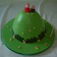 Peppa Pig Cake This is a childrens tv progamme in the UK..the little pigs live on top of a very high hill....All fondant and completely edible
