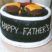 Grill Cake This was for my dad on father's day. We had a BBQ so the cake went along with it. It's a chocolate cake with peanut-butter...