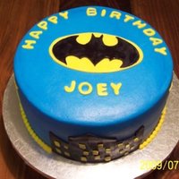 Batman 8 inch round. Iced in butter cream with fondant accents.