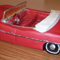 1962 Red Pontiac Bonneville Convertible White cake covered in fondant with fondant accents.