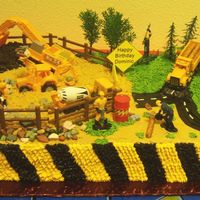 Construction Site Birthday Cake My first sheet cake. Two layer golden yellow with vanilla custard filling. All of the frosting is buttercream.