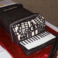 Accordion Cake This was my first carved cake. For my grandpa's 80th birthday, modeled after his accordion. It was WASC cake with strawberry filling