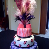 Johnni's 1St Birthday Cake Peacock feathers for topper. Bow and decorations done in fondant.