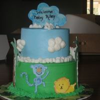 Jungle Shower Cake Buttercream frosting with RI jungle animals, gumpaste 'cloud' on top... still not sure why the cloud is blue... inspired by...