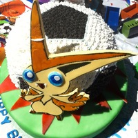 Soccer Ball With Pokemon Was a soccer ball cake , exploding from the grass . The pokemon is victini from pokemon black and white. cake was a butter cake and the...