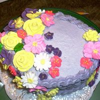 Basketweave/flowers This was a purple basketweave with muliple flowers in royal icing! Enjoy