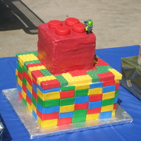 Lego Cake I used a Lego ice cube tray to make candy melt Legos, the sides of the bottom are fondant rectangles.