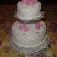 First Wedding Cake This was my first wedding cake. It was for 40 people. It is a white almond flavored cake with raspberry filling and buttercream frosting. I...