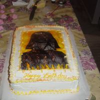 Darth Vader Marble cake frosted in buttercream. I striped the bag with yellow and orange to pick up the back round of the picture. The picture is...