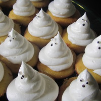 Halloween Ghosts Little ghosties for a Halloween party. Cuppie is white chocolate mocha topped with french vanilla buttercream.