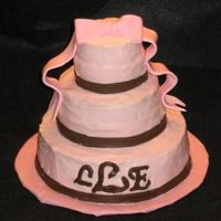 My Friend's Graduation Cake She loves brown and pink together. I made a pineapple cake with a concotion of bavarian creme/pineapple/mango/papaya mixed up and put in as...