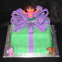 Dora Surprise Covered in mm fondant and mm fondant bow. Same thing here. Actually, I got the two pic mixed up!!! OH well. Both my daughters LOVED their...