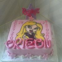 Bratz Birthday Cake Sponge cake filled with bc and jam, covered in fondant with gumpaste decorations and ri runout Cloe.