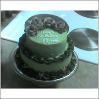 Birthday Stacked This was my first stacked cake. I did it for a friend's mom on her birthday last week. The cakes are both yellow with buttercream...