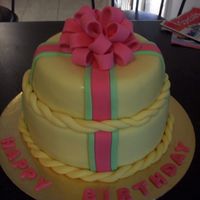 Stacked Cake With Bow This was my first attempt at a stacked cake and the first loop bow i've done. I would have liked the top layer to have been smaller...