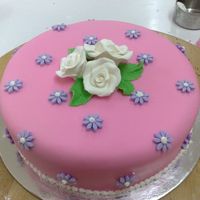 First Fondant Cake butter cake covered in fondant and fondant decor... gumpaste roses...thanks for looking!