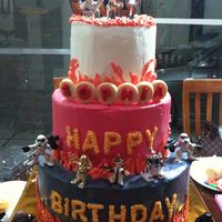Star Wars Cake chocolate cake with fudge filling... iced in buttercream....real toys as decor...thanks for looking! :)