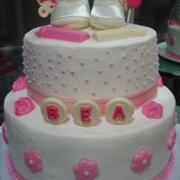 Baptism Cake For My Daughter chocolate cake with fudge filling..top tier is dummy...iced in buttercream...chocolate and fondant decorations...real shoes on top...thanks...