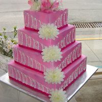 Pink Princess This is yet another display cake for our bakery window. Its all buttercream with real ribbon and silk flowers. The color is airbrushed on...