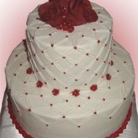 Burgandy Wine 6 and 10" - buttercream icing and details - fondant roses on top.