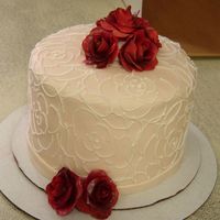 1St Anniversary This is a cake I made for my brother and his wife's 1st anniversary. I designed it after her wedding dress. Its fondant covered in...