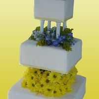 Bethany fondant covered with real flowers and ribbon