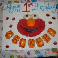 Elmo 1St Birthday Cake This is my son's first Birthday cake,(7/4/06) Elmo which he loves and My first time baking a cake like this and I had alot of fun with...
