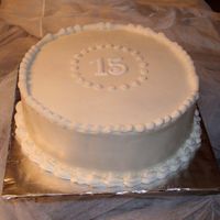 Very Tradional this is for a friend's party her mom wanted the cake to look just like one for her mother's 50th. I was a little worried as i...