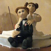 Shrout_Figures.jpg Bride wanted the groom's cake to have a subtle homage to Star Wars. So groom has a light saber and she has the hair...