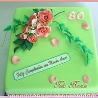 Happy Birthday Grandma! Belgian chocolate cake, covered with rolled fondant. Flowers are gumpaste.