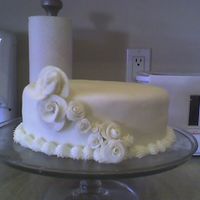 Practice Cake This is my friend and I's first time using fondant. I had one HUGE hole from where it stuck to my counter so we patched it and covered...