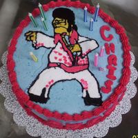Birthday Cake I made this cake for my boyfriend's birthday. He LOVES the tv show The Simpsons. The cake is chocolate filled with cream cheese iceing...